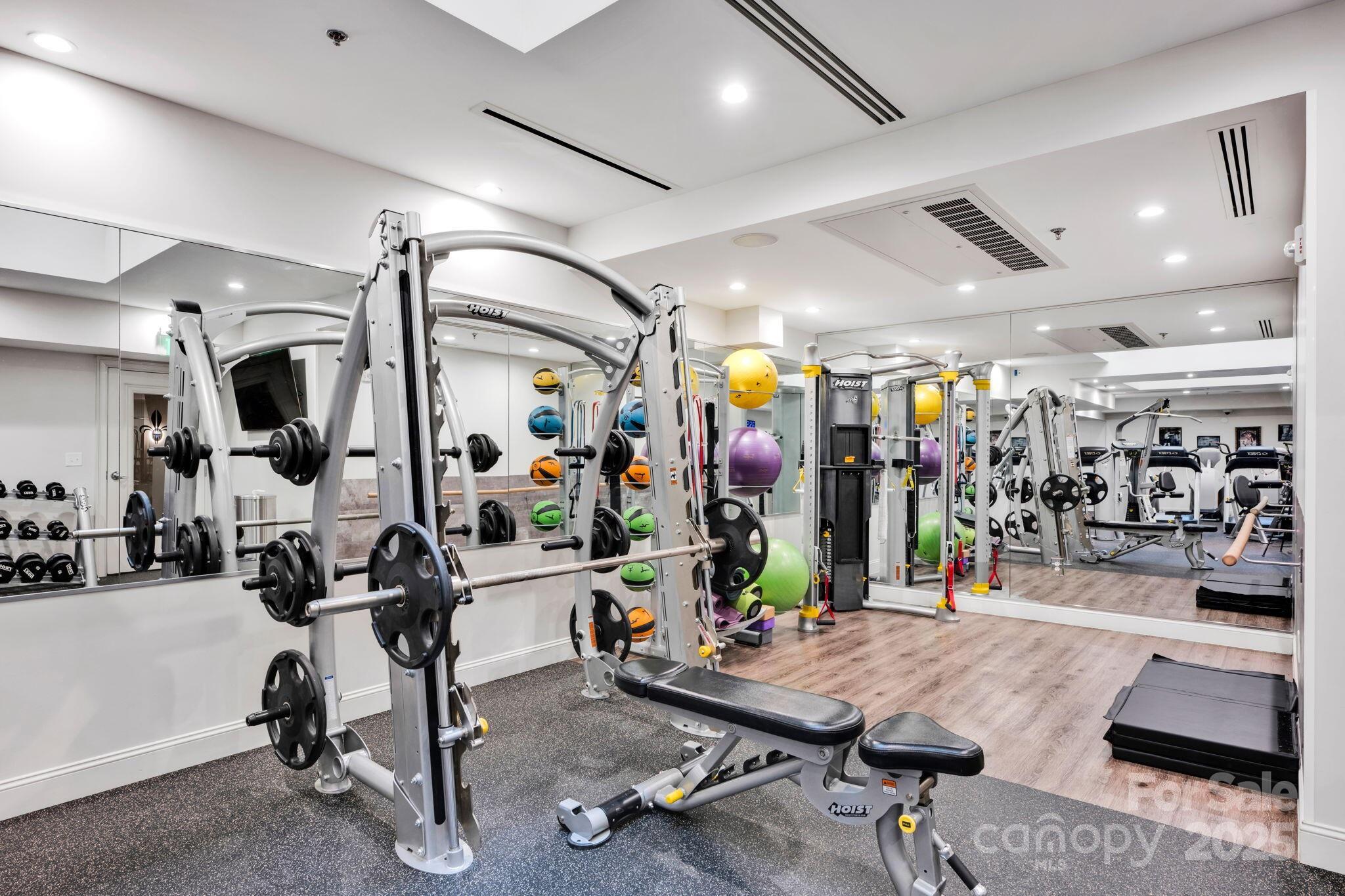 127 North Tryon Street, Unit 404 Charlotte, NC 28246 - Photo 21 of 22 a view of a room with gym equipment