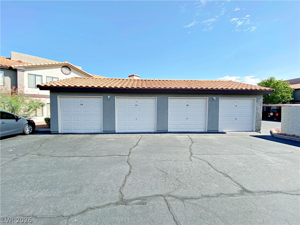 1575 West Warm Springs Road, Unit 1024 Henderson, NV 89014 - Photo 21 of 25 Attached garage units with overhead doors provide convenient vehicle storage.