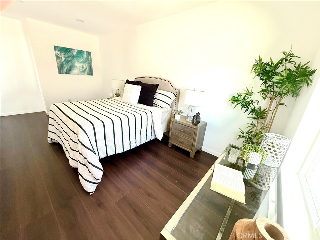 8231 Comolette Street Downey, CA 90242 - Photo 20 of 25 a bedroom with a bed and a potted plant