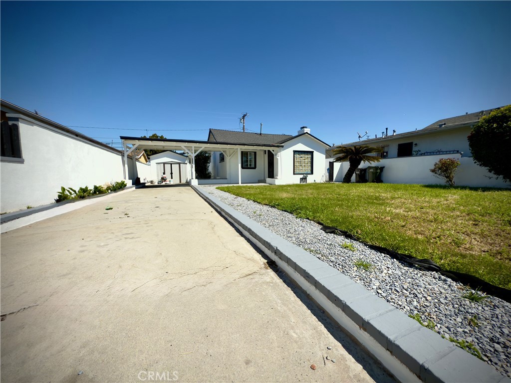 8231 Comolette Street Downey, CA 90242 - Photo 2 of 25 a view of residential houses with yard and mountain view in back