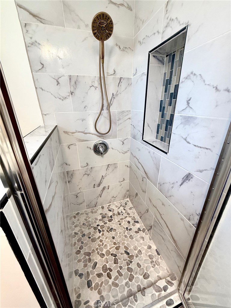 8231 Comolette Street Downey, CA 90242 - Photo 22 of 25 a bathroom with a shower