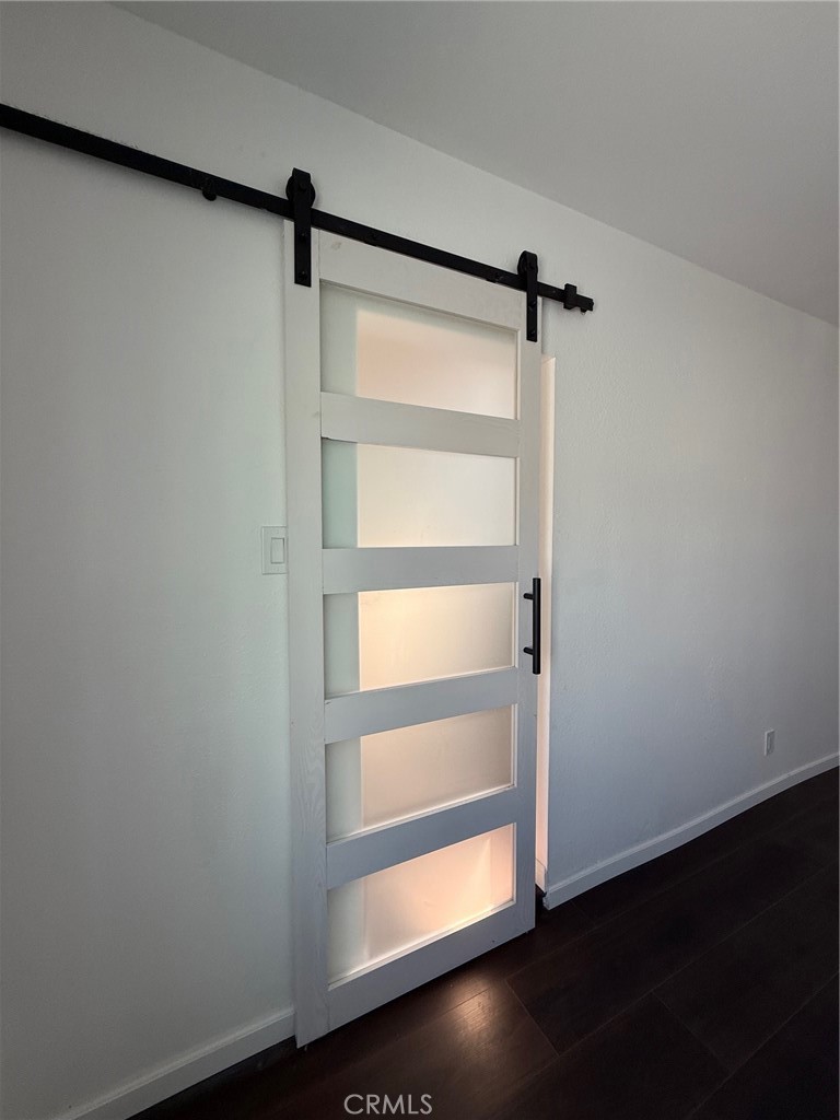 8231 Comolette Street Downey, CA 90242 - Photo 23 of 25 a view of a room with wooden floor