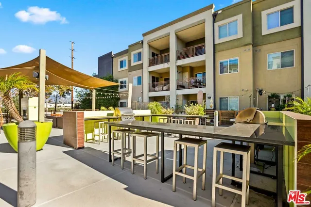 a view of a patio with couches table and chairs