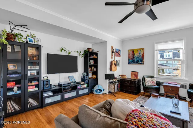 a living room with furniture workspace and a window
