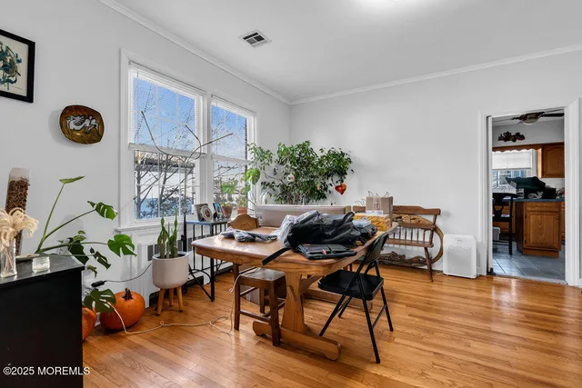 a workspace with furniture and wooden floor