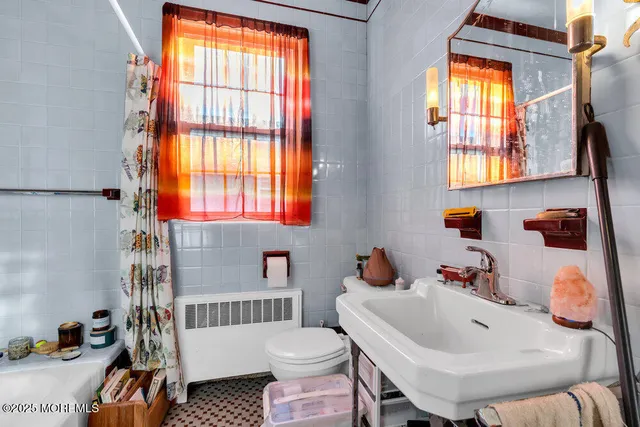 a bathroom with a sink and a window