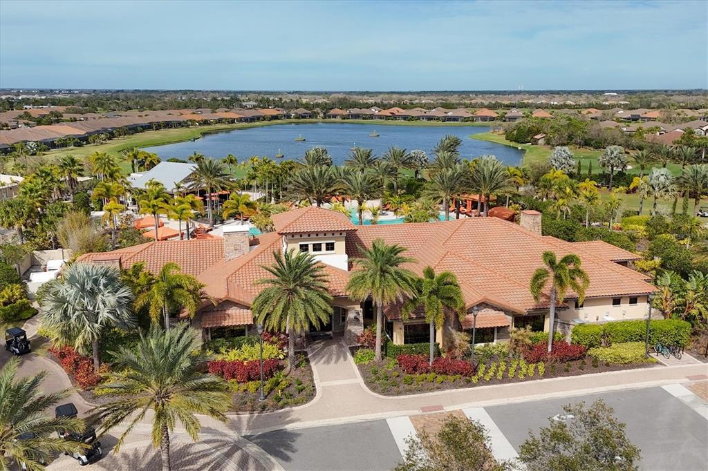13703 Messina Loop, Unit 102 Bradenton, FL 34211 - Photo 52 of 74 an aerial view of residential houses with outdoor space
