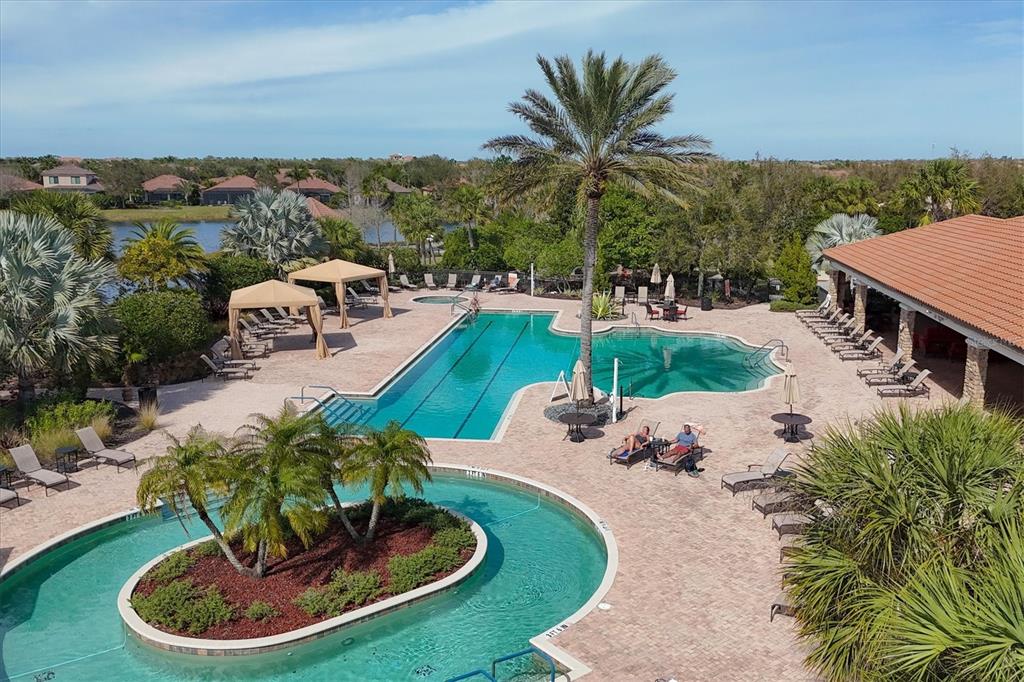 13703 Messina Loop, Unit 102 Bradenton, FL 34211 - Photo 68 of 74 a view of a swimming pool with a patio