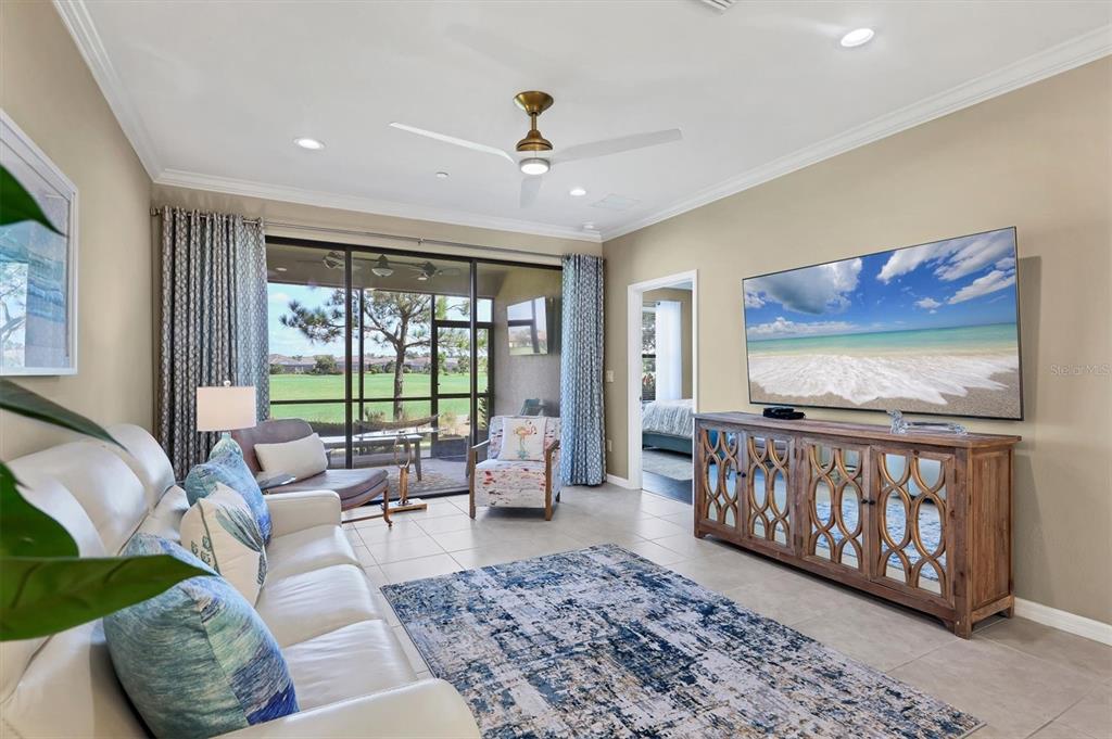 13703 Messina Loop, Unit 102 Bradenton, FL 34211 - Photo 10 of 74 a living room with furniture and a large window