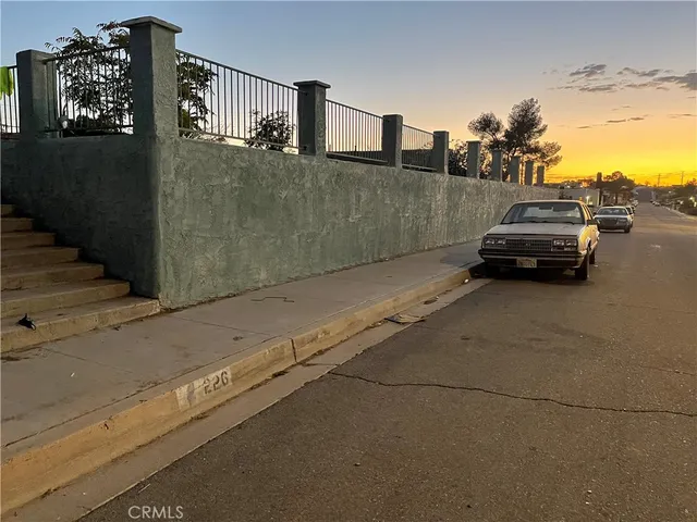 a view of a car parked on the street