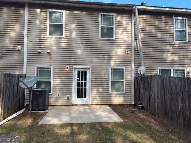 a view of backyard with a door