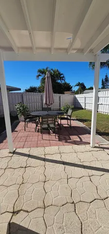 a view of a room with wooden stairs