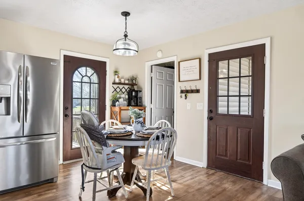 a view of a dining room with furniture window and wooden floor