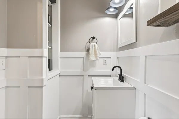 a bathroom with a sink and mirror