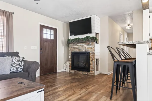 a living room with furniture and a fireplace