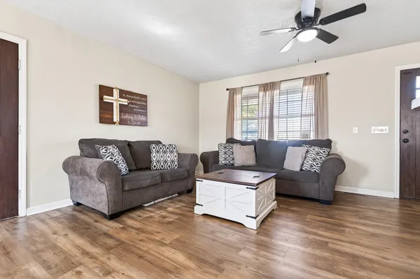 a living room with furniture and a large window