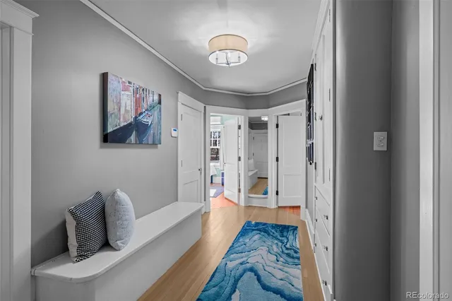 a bedroom with furniture and a rug