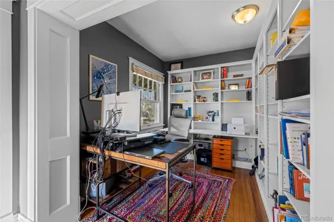 a room with furniture and a bookshelf