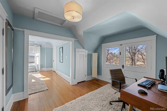 a workspace with furniture and window