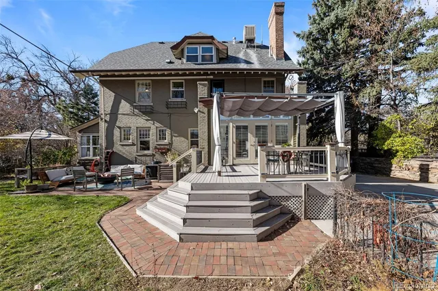 a front view of a house with a yard table and chairs