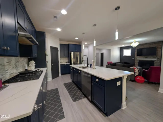 a kitchen with kitchen island granite countertop lots of counter top space