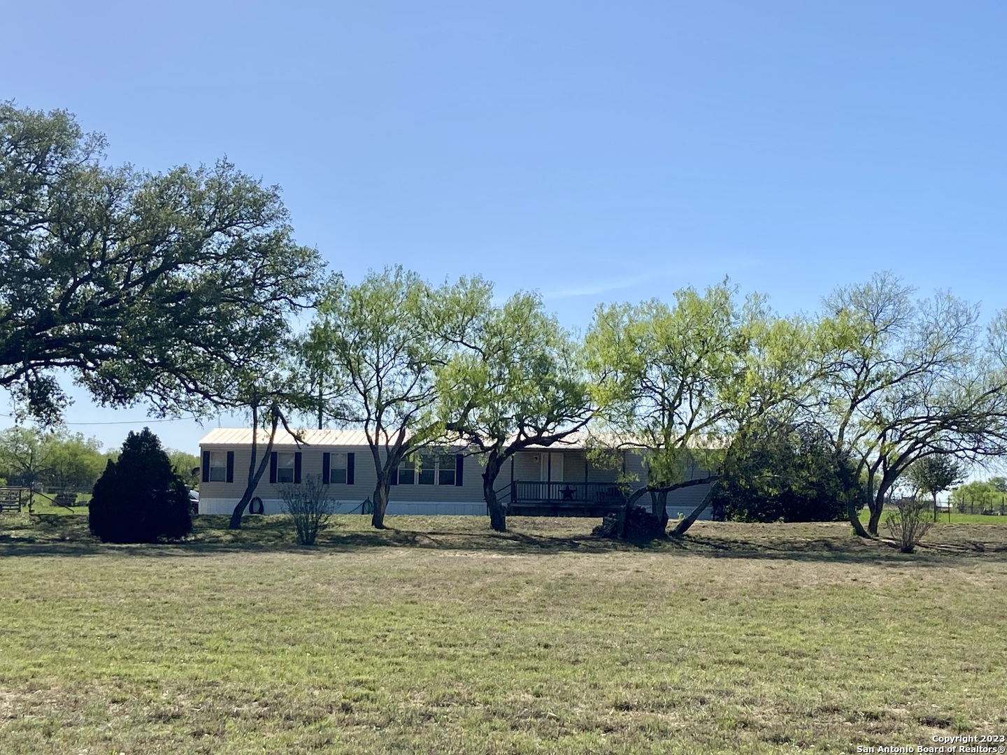 425 County Road 775 Devine, TX 78016 - Photo 1 of 1 a swimming pool with outdoor seating and yard