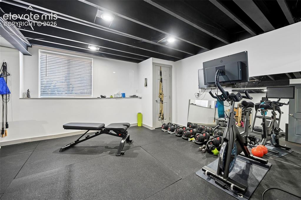 10643 Pictured Rocks Drive Peyton, CO 80831 - Photo 31 of 37 a view of a room with gym equipment