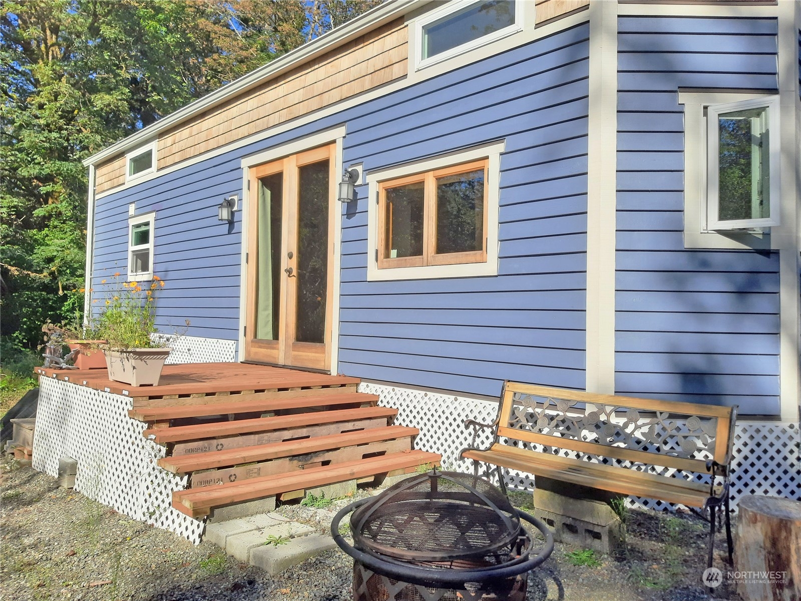 a front view of a house with a chairs