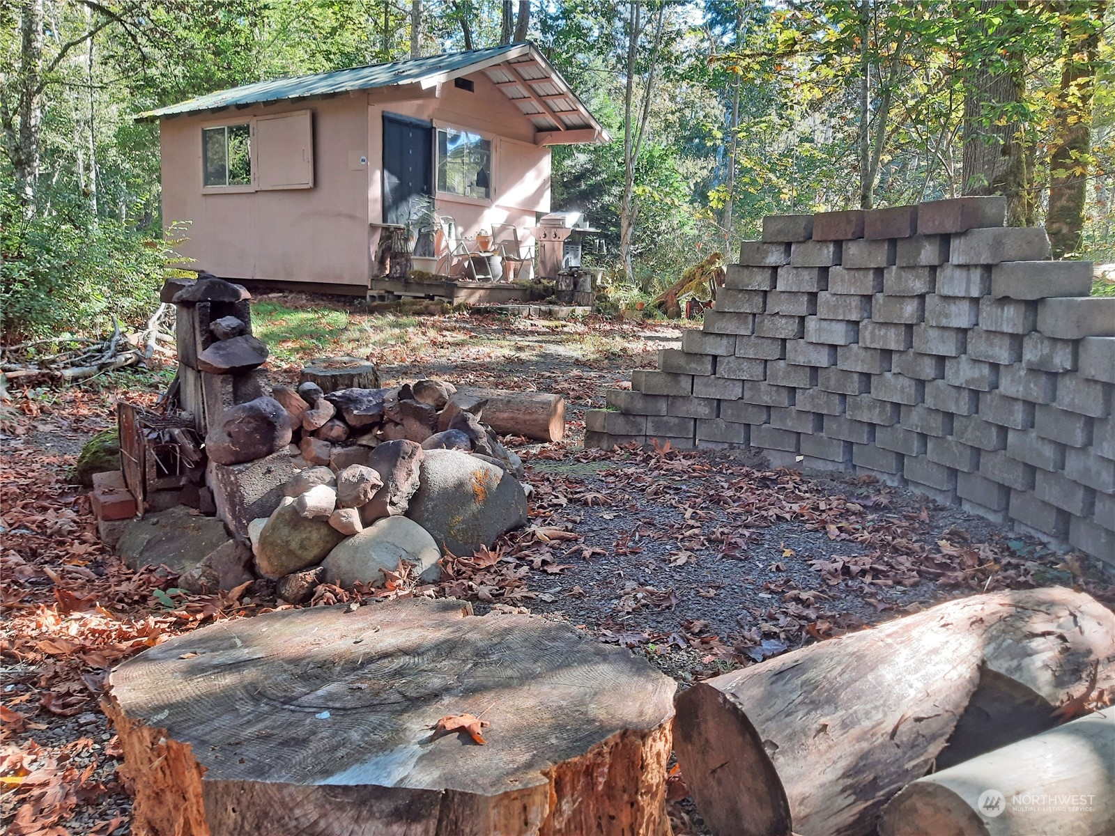 0 Lakenes Road Quilcene, WA 98376 - Photo 17 of 25 a backyard of a house with table and chairs