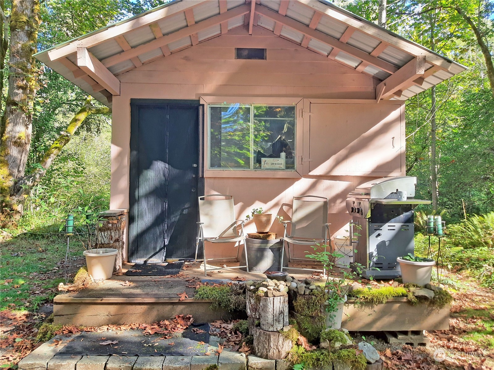 0 Lakenes Road Quilcene, WA 98376 - Photo 18 of 25 a front view of house with a garden