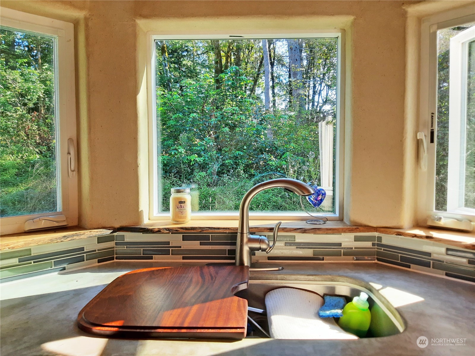 0 Lakenes Road Quilcene, WA 98376 - Photo 7 of 25 a kitchen with a sink and a large window