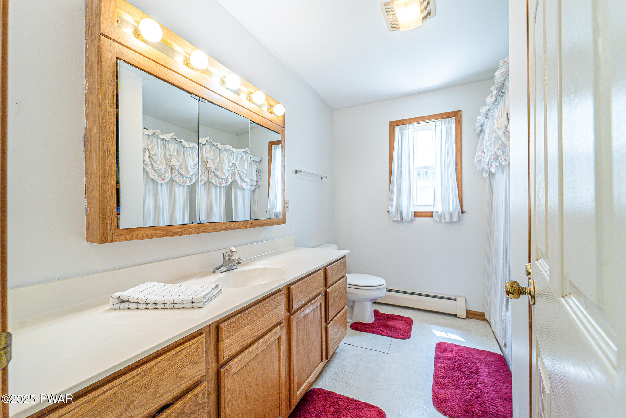 101 Maple Ridge Road Milford, PA 18337 - Photo 26 of 39 a bathroom with a sink vanity and a mirror