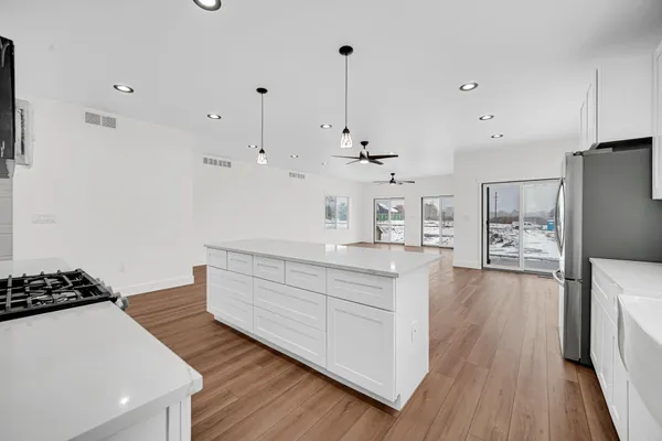 a view of a workspace with wooden floor