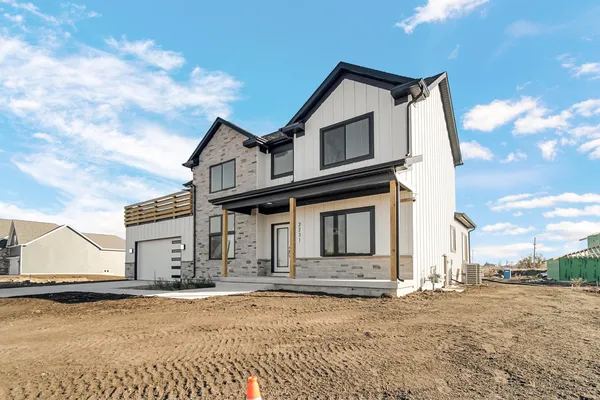 a large kitchen with stainless steel appliances lots of counter space and wooden floor