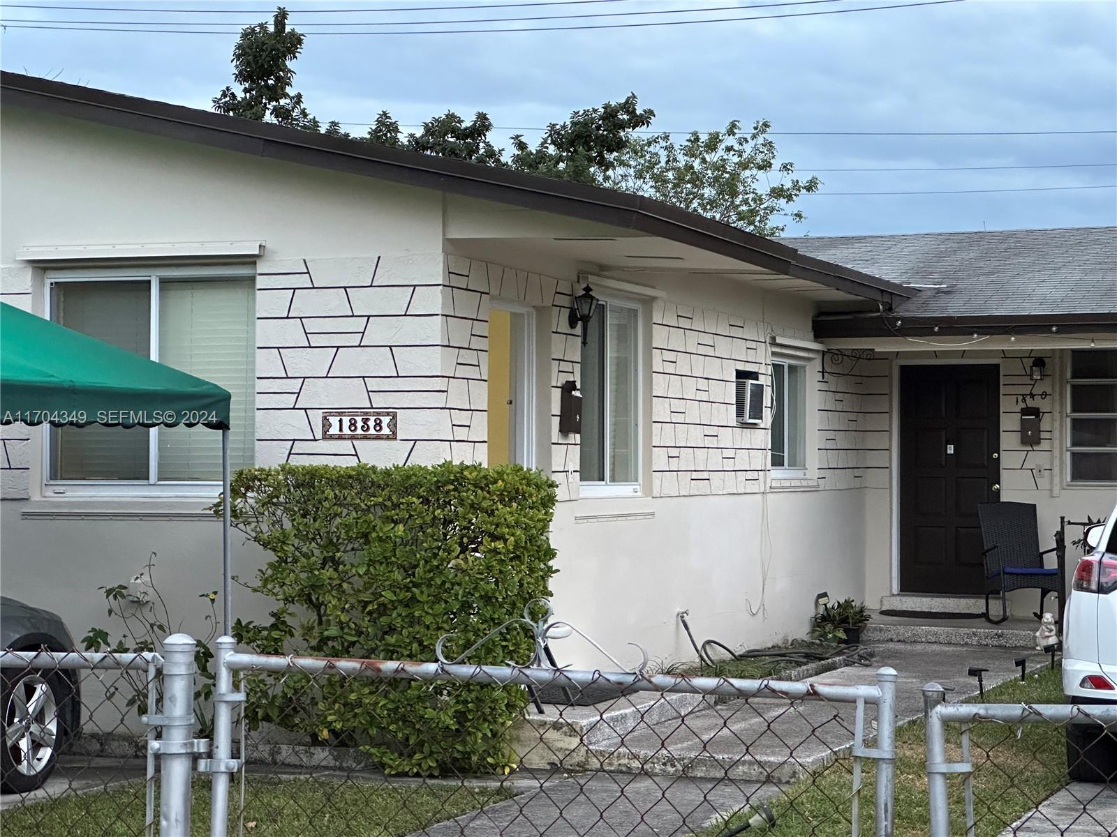 1838 Northwest 18th Street Miami, FL 33125 - Photo 3 of 22 a front view of a house with garden