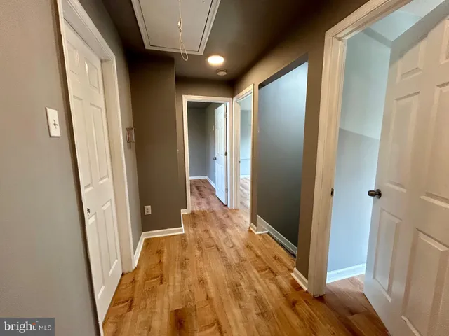 a room with a sink and a mirror