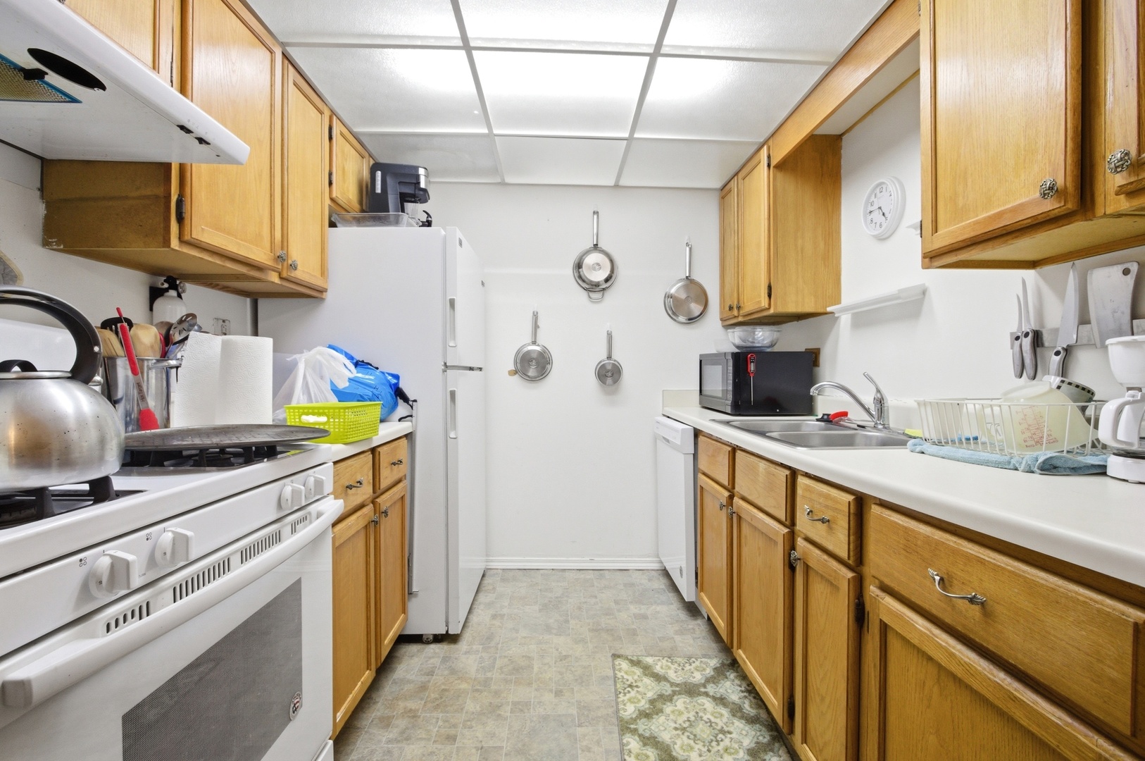 154 East Bailey Road, Unit D Naperville, IL 60565 - Photo 5 of 20 a kitchen with stainless steel appliances granite countertop a sink and cabinets