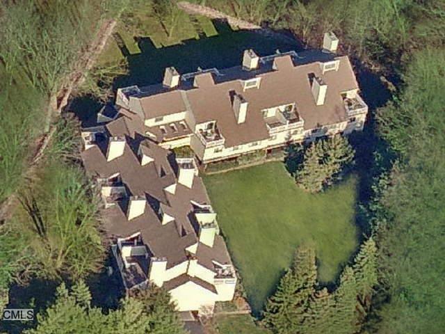 an aerial view of a house with a lake view
