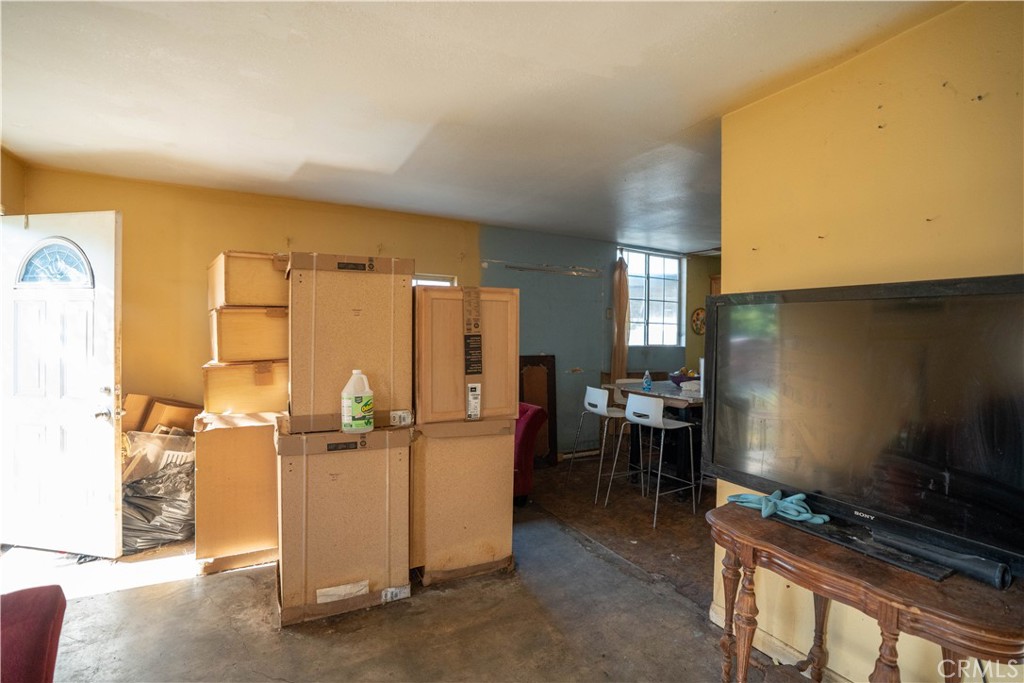 6174 Jurupa Avenue Riverside, CA 92504 - Photo 20 of 30 a kitchen with refrigerator and table