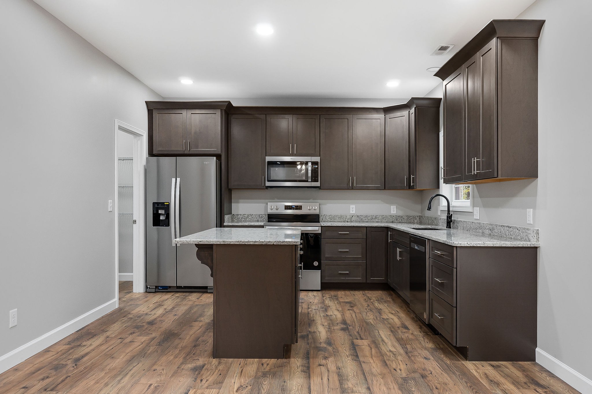 179 Park Road Rickman, TN 38580 - Photo 10 of 29 a kitchen with stainless steel appliances granite countertop a stove top oven a sink and a refrigerator