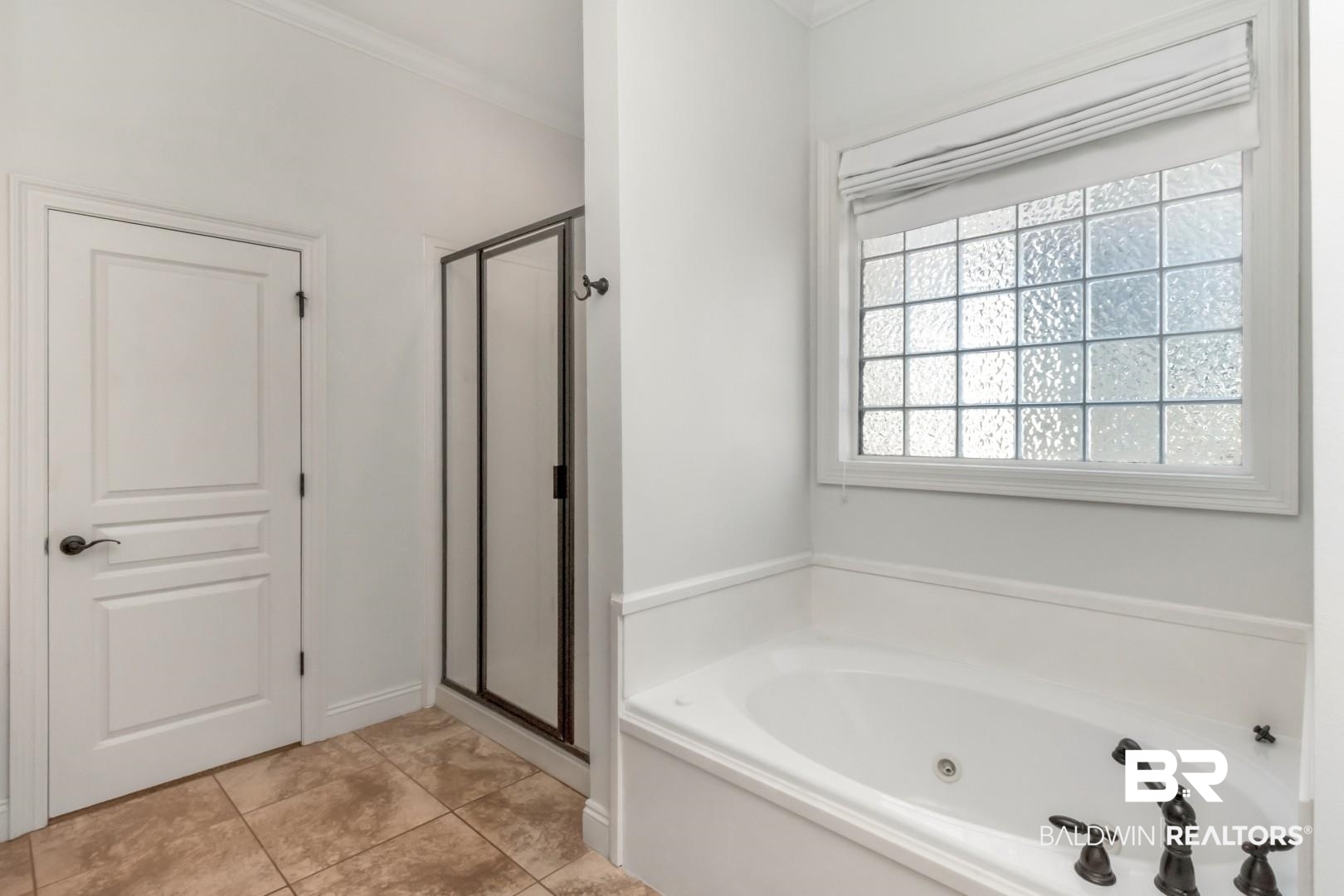 30585 Pine Court Daphne, AL 36527 - Photo 14 of 49 Full bathroom featuring a stall shower, a tub with jets, ornamental molding, and light tile patterned flooring