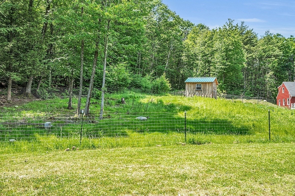 201 Taylor Road Ashby, MA 01431 - Photo 36 of 40 a view of a house with a big yard and a large trees