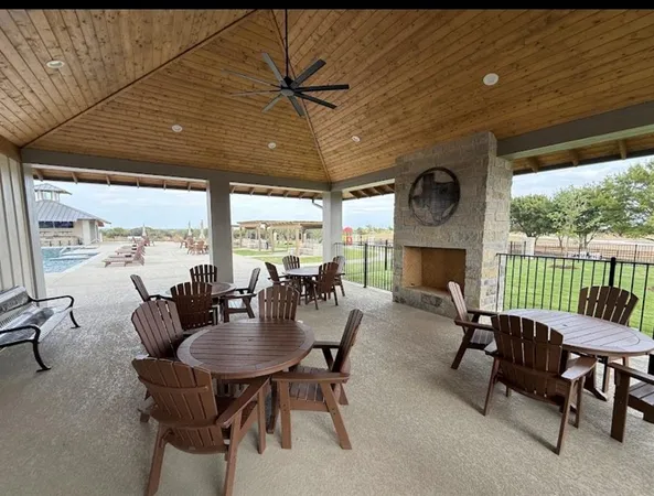 a dining room with furniture window and outside view