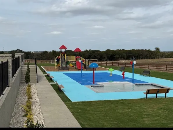 a view of a swimming pool with lounge chairs