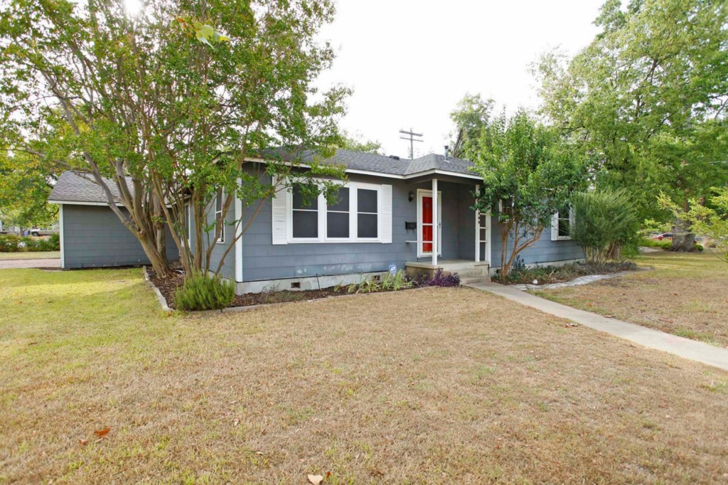 5809 Link Avenue Austin, TX 78752 - Photo 1 of 1 a front view of a house with yard and tree