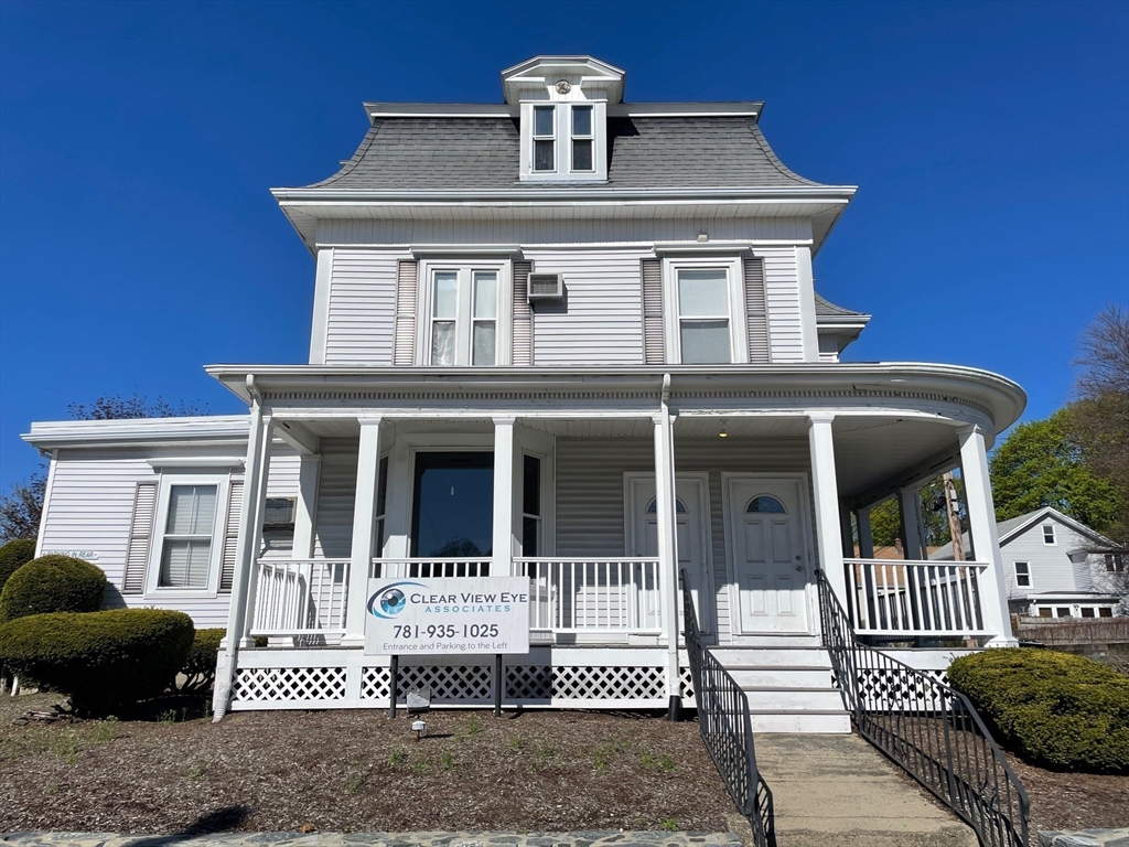 550 Main Street, Unit 2 Woburn, MA 01801 - Photo 1 of 14 a front view of a house with a porch