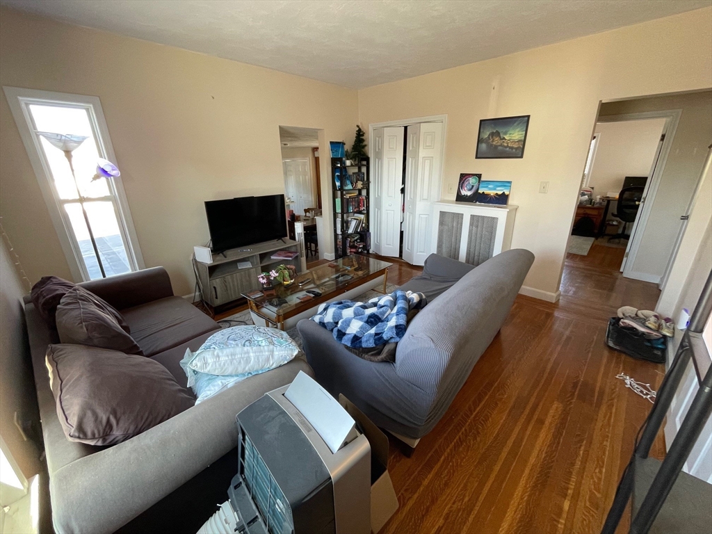 550 Main Street, Unit 2 Woburn, MA 01801 - Photo 3 of 14 a living room with furniture and a flat screen tv