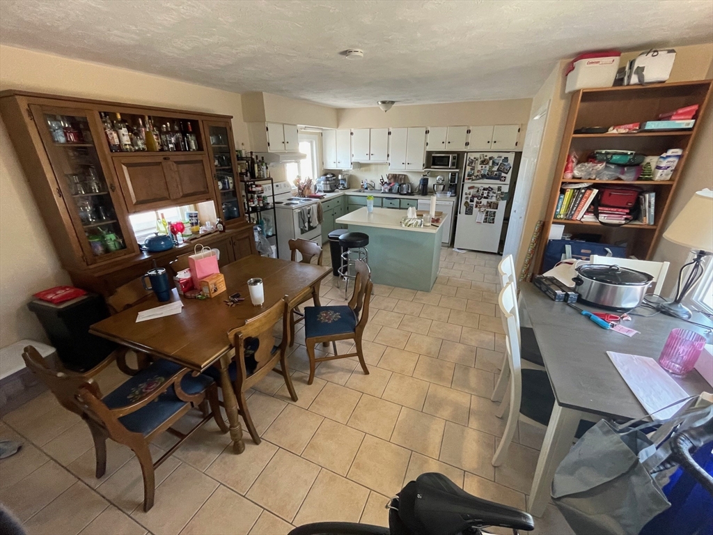 550 Main Street, Unit 2 Woburn, MA 01801 - Photo 5 of 14 a view of a dining room with furniture