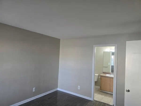 an empty room with a bathroom
