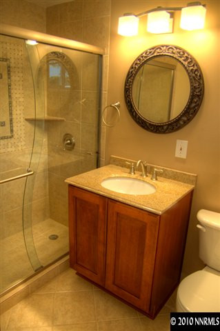 1770 Wren Street Reno, NV 89509 - Photo 8 of 9 a bathroom with a sink mirror vanity and toilet